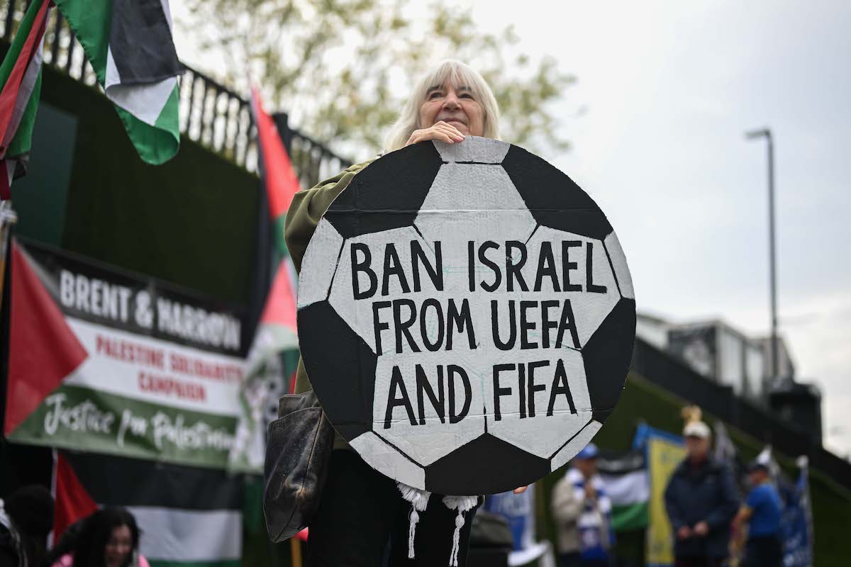 People carrying Palestinian flags and banners, stage a demonstration and march to Wembley Stadium demanding Israel's suspension from UEFA and FIFA, in London, United Kingdom on October 2, 2025. [Raşid Necati Aslım - Anadolu Agency]