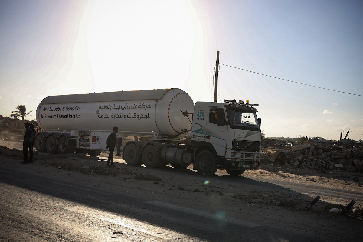 Trucks carrying fuel enter Gaza through Karem Abu Salem crossing and reach Deir al-Balah under cease-fire agreement in Gaza on October 12, 2025. [Abdalhkem Abu Riash - Anadolu Agency]