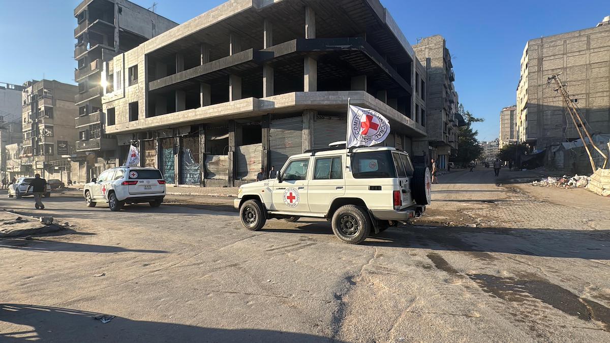 Hamas members hand over some of the 20 Israeli hostages to International Committee of the Red Cross (ICRC) teams as part of the ceasefire and prisoner and hostage swap deal between Hamas and Israel in Gaza City, Gaza, on October 13, 2025. [Hamza Z. H. Qraiqea - Anadolu Agency]