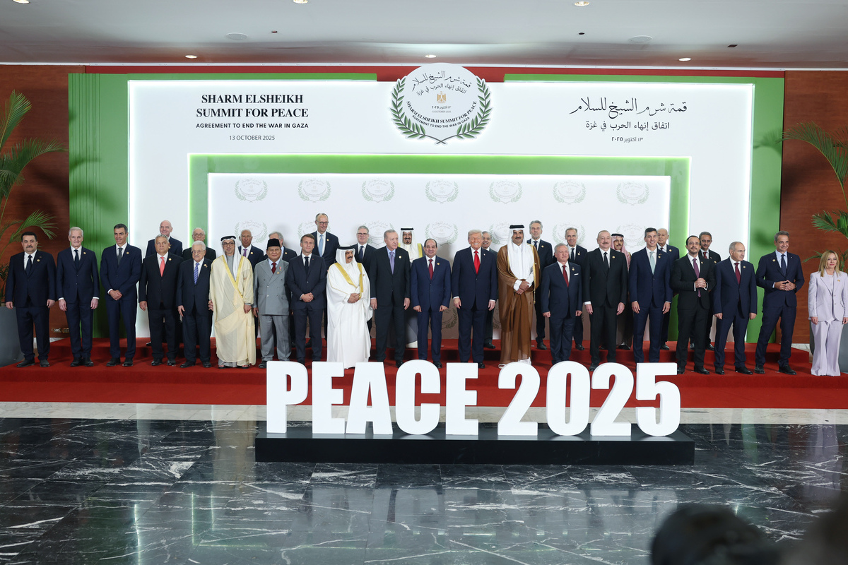 World leaders pose for a family photo ahead of the Sharm El-Sheikh Peace Summit in Sharm El-Sheikh, Egypt on October 13, 2025. [TUR Presidency/ Mustafa Kamaci - Anadolu Agency]