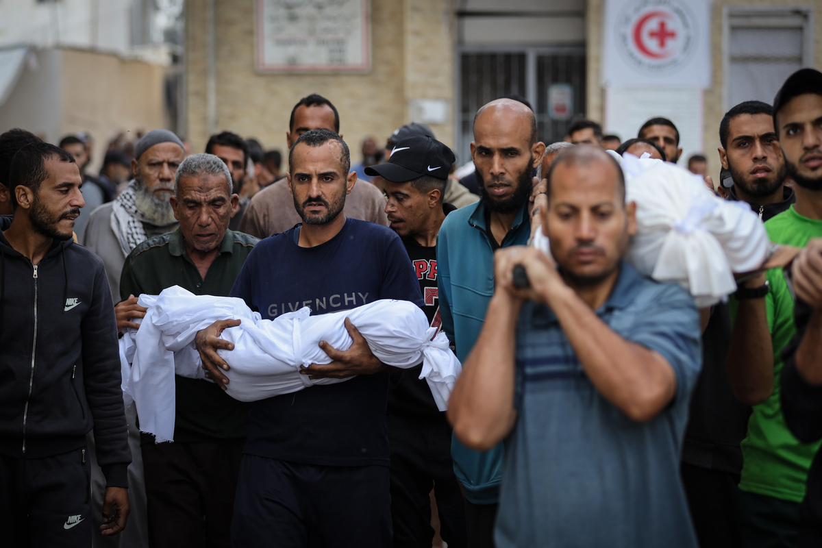People attend the funeral held at Al Ahli Baptist Hospital for Palestinians who were killed in the Israeli attack on Zaytun, despite the ceasefire in Gaza City, Gaza on October 29, 2025. [Khames Alrefi - Anadolu Agency]
