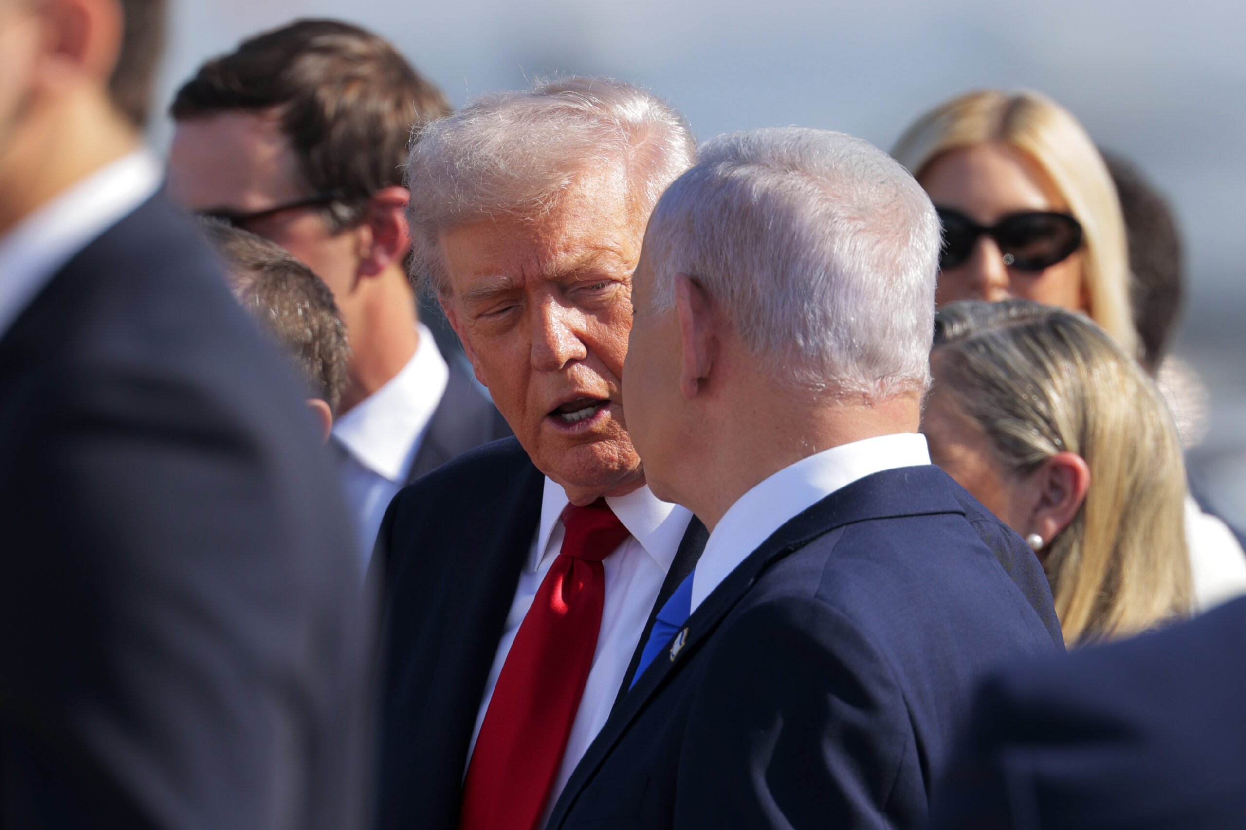 US President Donald Trump (C) is welcomed by Israeli Prime Minister Benjamin Netanyahu at Ben Gurion International Airport on October 13, 2025 in Tel Aviv, Israel. [Chip Somodevilla/Getty Images]