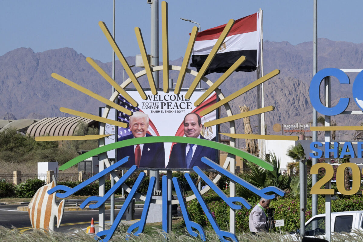 This photograph shows a billboard bearing the portraits of US President Donald Trump (L) and Egyptian President Abdel Fattah al-Sisi outside the congress centre ahead of the Sharm El-Sheikh Peace Summit in the Egyptian Red Sea resort town of Sharm el-Sheikh on October 13, 2025. [KHALED DESOUKI/AFP via Getty Images]