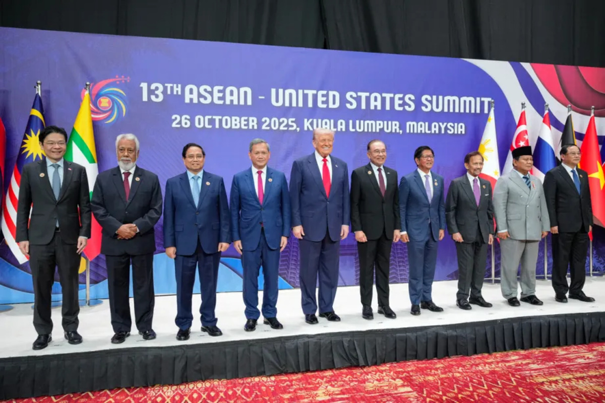 US President Donald Trump (C) poses for a group photo with (from L - R) Singapore's Prime Minister Lawrence Wong, East Timor's Prime Minister Xanana Gusmao, Vietnam's Prime Minister Pham Minh Chinh, Cambodia's Prime Minister Hun Manet, Malaysia's Prime Minister Anwar Ibrahim, Philippines' President Ferdinand Marcos Jr, Sultan of Brunei Hassanal Bolkiah, Indonesia's President Prabowo Subianto, and Laos' Prime Minister Sonexay Siphandone before the 13th ASEAN - United States Summit during the 47th Association of Southeast Asian Nations (ASEAN) Summit in Kuala Lumpur on October 26, 2025. [Photo by VINCENT THIAN/POOL/AFP via Getty Images]