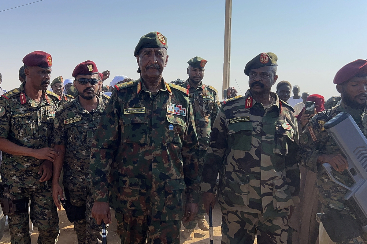Sudan’s Sovereignty Council Chairman and Army Commander Gen. Abdel Fattah al-Burhan visits the newly established Al-Afadh camp in Al Dabbah, Northern State, where tens of thousands of Sudanese have taken refuge after being displaced by clashes following the Rapid Support Forces’ takeover of El Fasher, the capital of North Darfur, on October 26, in Al Dabbah, Sudan, on November 8, 2025. [Stringer - Anadolu Agency]