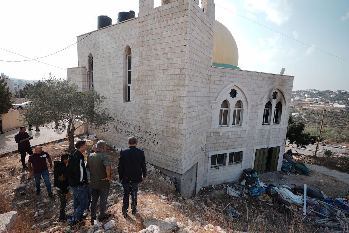 A view of the mosque which Israelis have set fire to, and wrote racist slogans on its walls in Salfit, West Bank on November 13, 2025. [Issam Rimawi - Anadolu Agency]