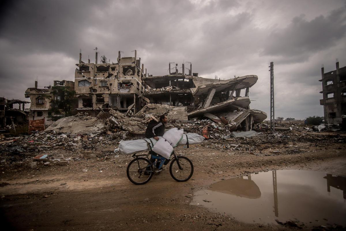 Palestinians live under harsh conditions as heavy rainfall flood the tents sheltering displaced Palestinians amid Israeli attacks at the Zeitoun neighborhood in the eastern part of Gaza on December 12, 2025. [Saeed M. M. T. Jaras - Anadolu Agency]
