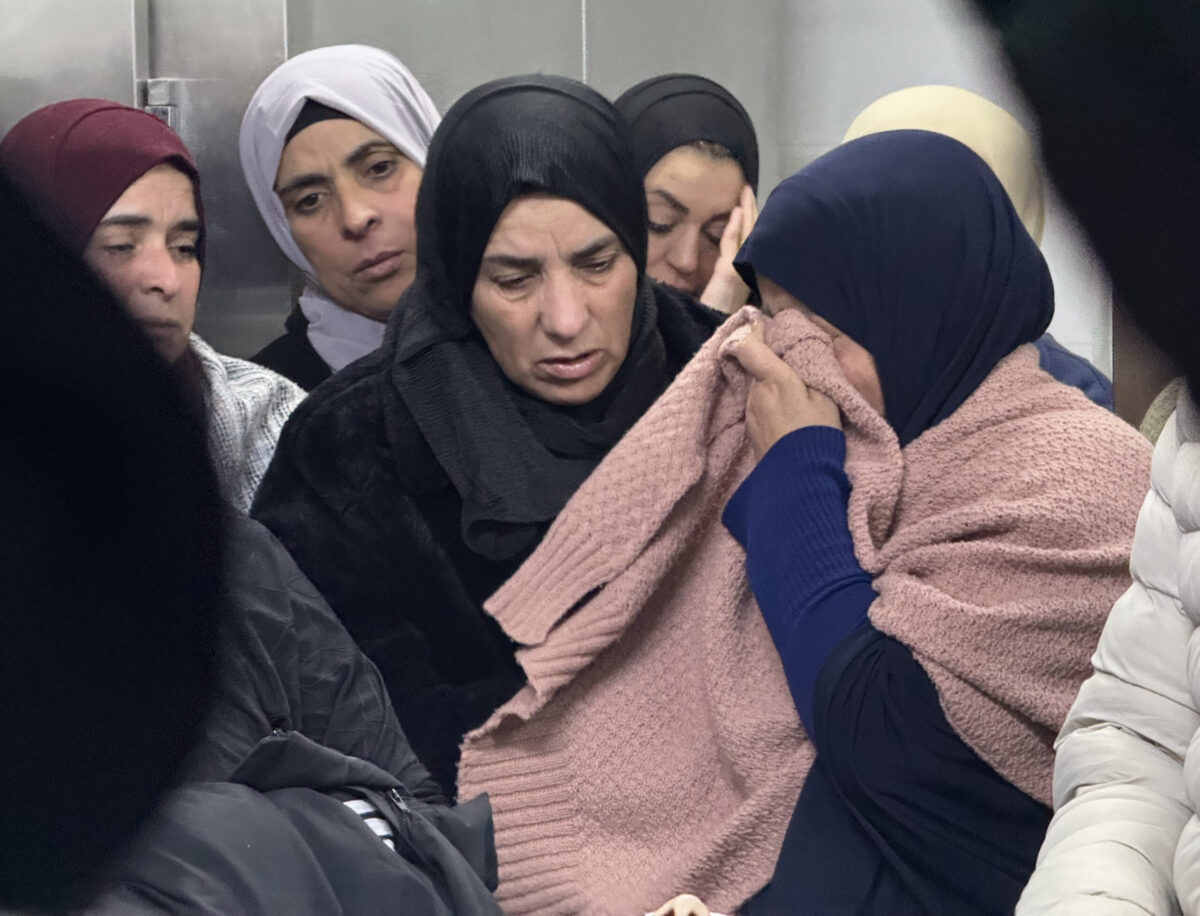 Relatives of 17-year-old Ammar Yasser al-Sabah mourn and wail over his body after he was shot in the chest and killed by Israeli soldiers during a raid on the town of Tuqu, south of Bethlehem, in the West Bank on December 15, 2025. [Hisham K. K. Abu Shaqra - Anadolu Agency]