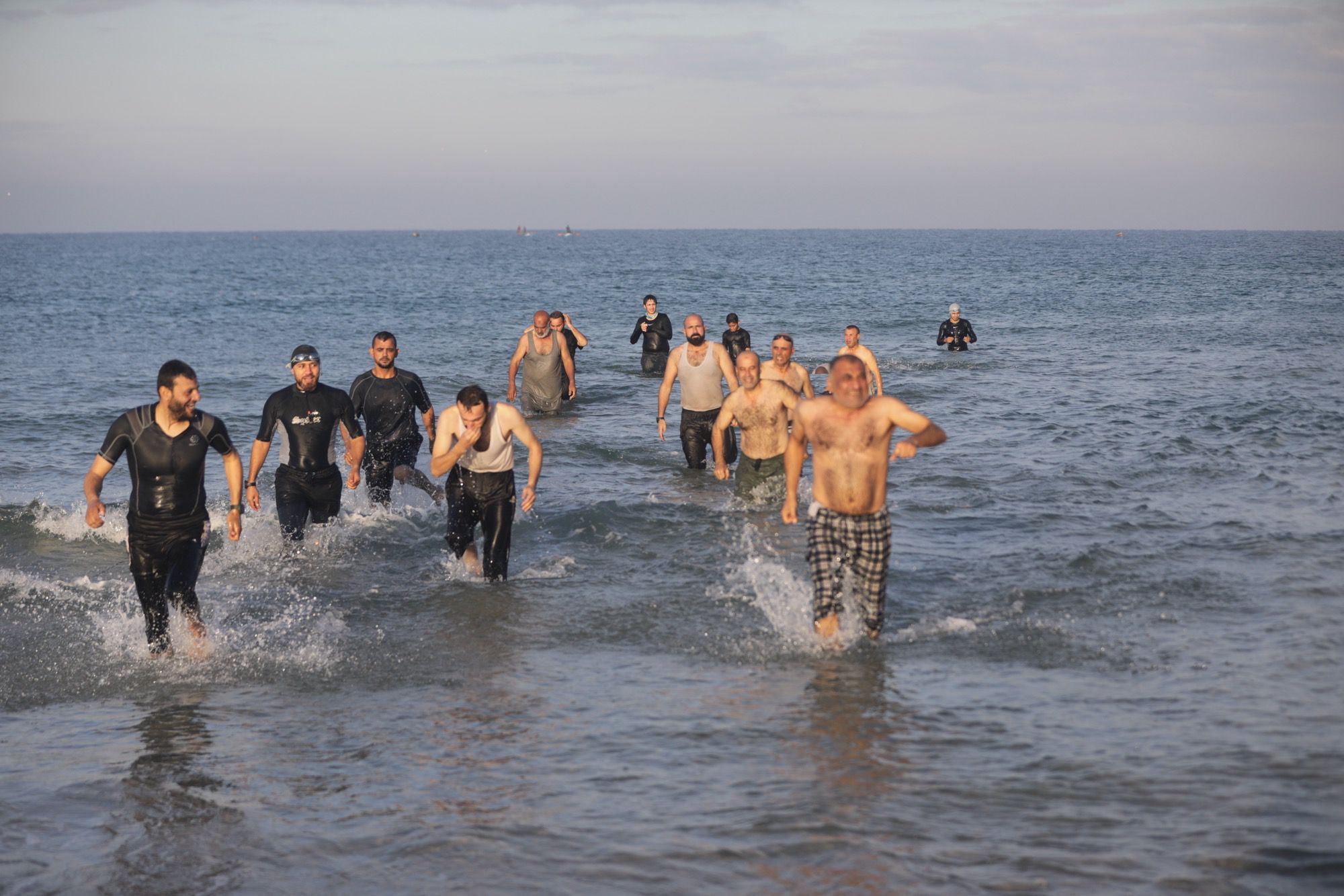 Palestinians in Gaza swim in the Mediterranean Sea, seeking moments of calm and psychological recovery after the war, on 26 December 2025 [Mohammed Asad/Middle East Monitor]