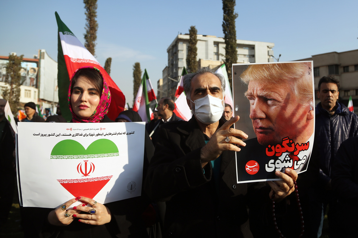 People gather at Enghelab Square after a government call to rally against recent protests across the country, chanting anti-U.S. and anti-Israel slogans, in Tehran, Iran, on January 12, 2026. [Fatemeh Bahrami - Anadolu Agency]