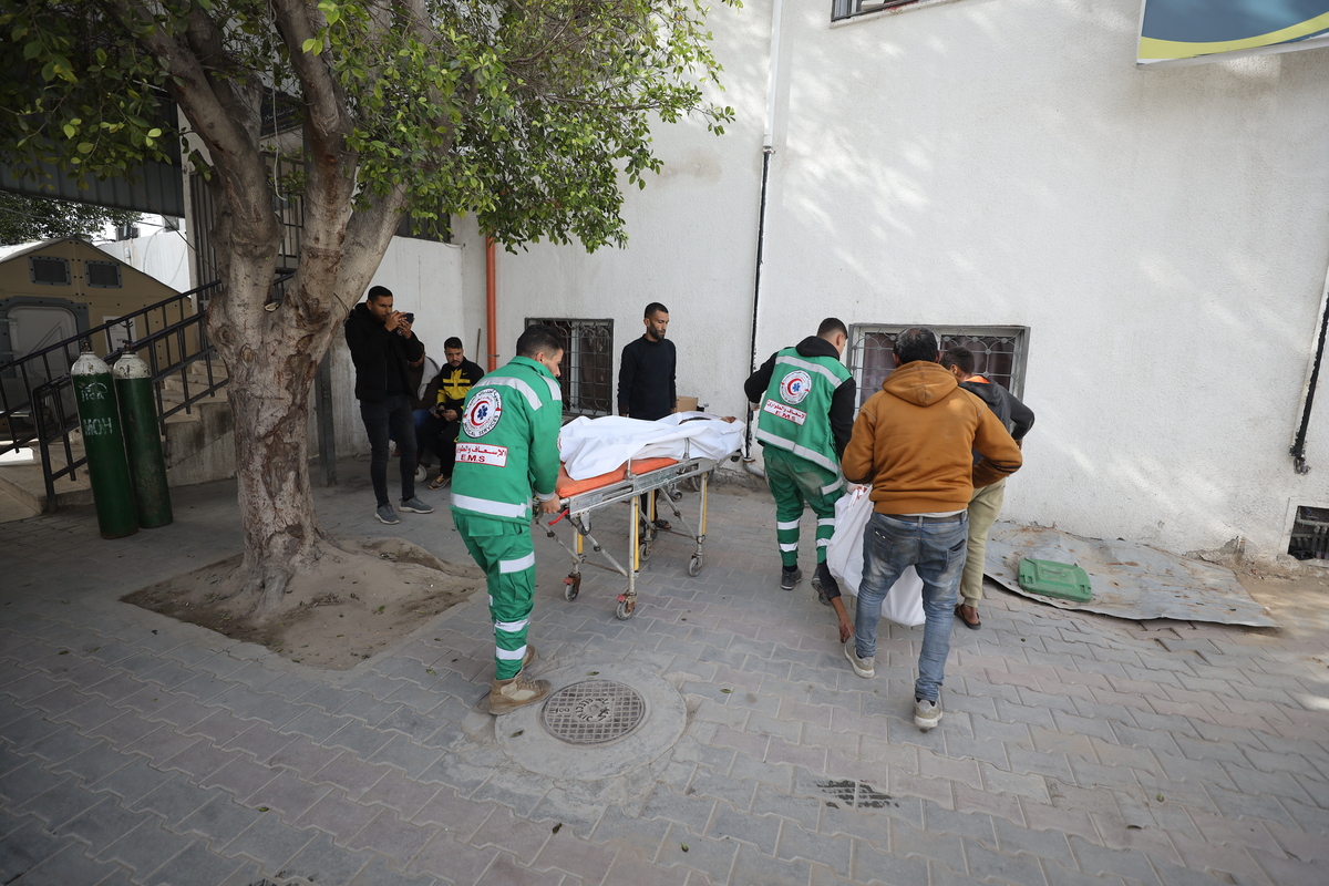 Medical teams carry the dead bodies of the two teenagers from the Al-Zawara family, Salman Zakaria, 14, and Mohammed Youssef, 15, were killed when an Israeli bomb exploded near Kamal Adwan Hospital in the Beit Lahia project area, to the al-Shifa Hospital in Gaza City, Gaza on January 24, 2026. [Khames Alrefi - Anadolu Agency]