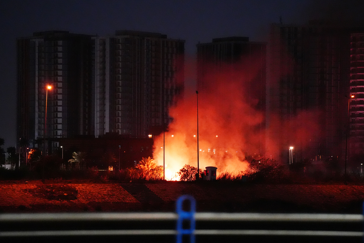 Smoke and flame rise near US Embassy compound after suicide drone attack in Baghdad, Iraq on March 17, 2026. [Murtadha Al-Sudani - Anadolu Agency]