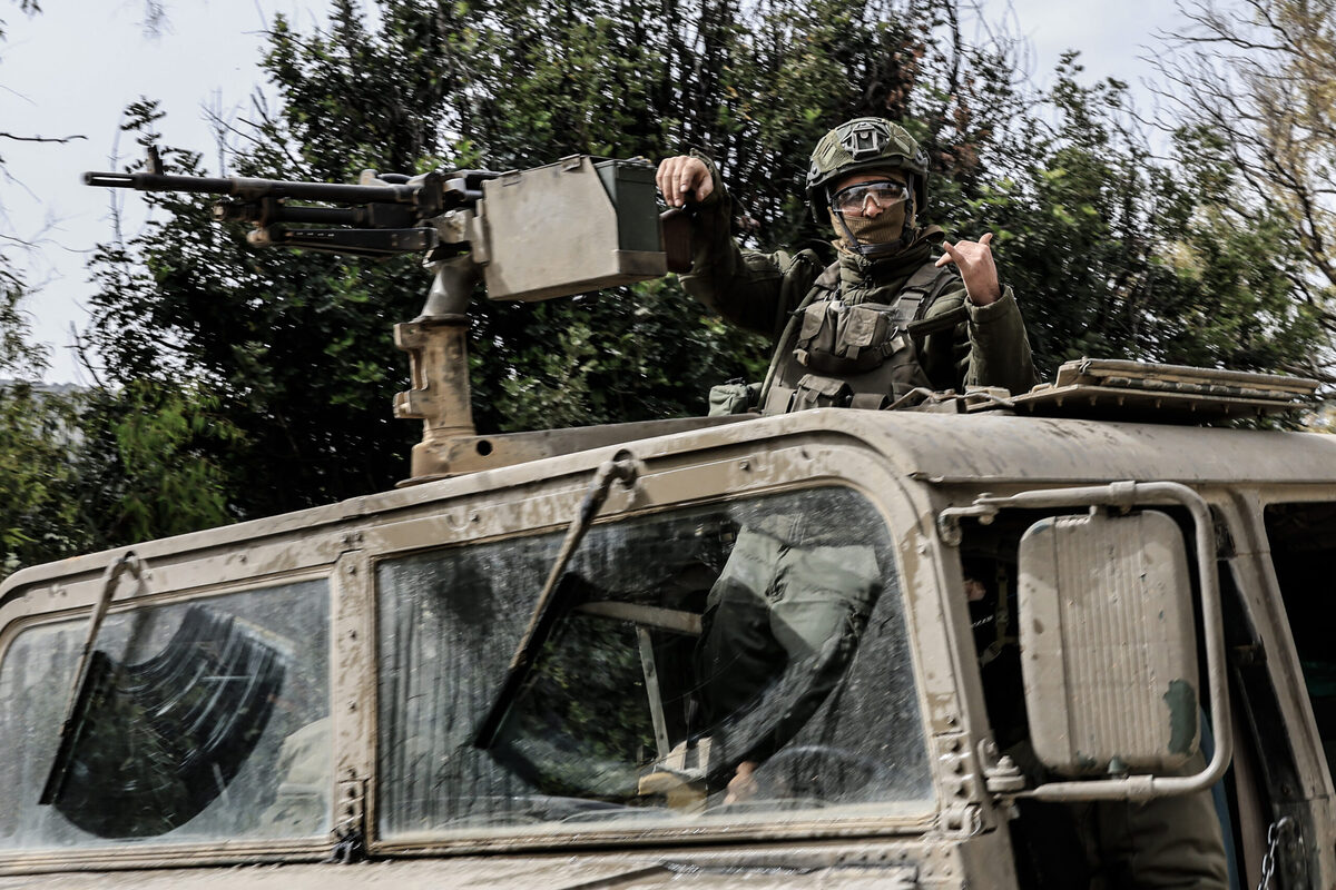 Israeli military vehicles and tanks are stationed near the Lebanese border in northern Israel on March 14, 2026. [Tsafrir Abayov - Anadolu Agency]