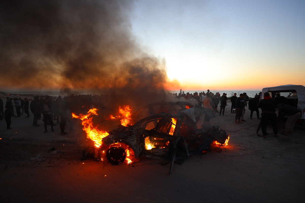 A vehicle burns after being hit in an Israeli strike at the Nabulsi junction in Gaza City, northern Gaza Strip on April 8, 2026. Al Jazeera Mubasher correspondent Mohammed Washah was killed in the attack. [Khames Alrefi - Anadolu Agency]