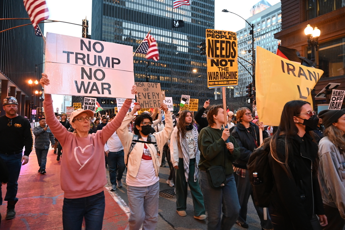 Protesters march through downtown Chicago during an "Emergency Protest" on April 8, 2026 in Chicago, Illinois, United States. [Jacek Boczarski - Anadolu Agency]