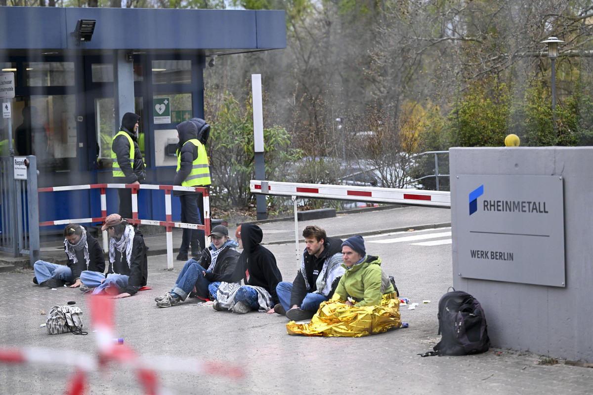 Seven activists from the pro-Palestinian group “Peacefully Against Genocide” stage a sit-in at the entrance of the Rheinmetall premises in the Wedding district, gluing their hands to the ground as they protest the company over allegations of supplying weapons to Israel, in Berlin, Germany on April 10, 2026. [Halil Sağırkaya - Anadolu Agency]