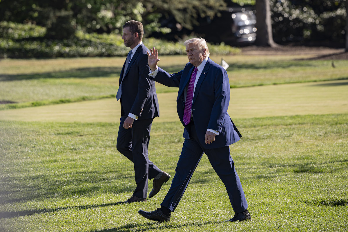 US President Donald Trump (R) and his son Eric Trump (L) depart the White House en route to Charlottesville, Virginia on April 10, 2026, in Washington DC. [Celal Güneş - Anadolu Agency]