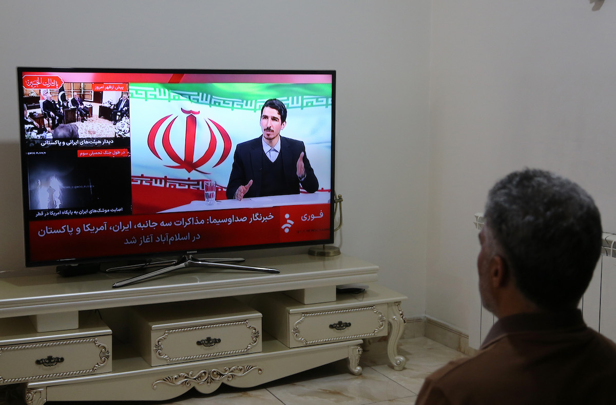 An Iranian resident follows developments regarding the talks through news channels as talks between the United States and Iran have begun in Islamabad, Pakistan on April 11, 2026, in the capital Tehran, Iran. [Fatemeh Bahrami - Anadolu Agency]