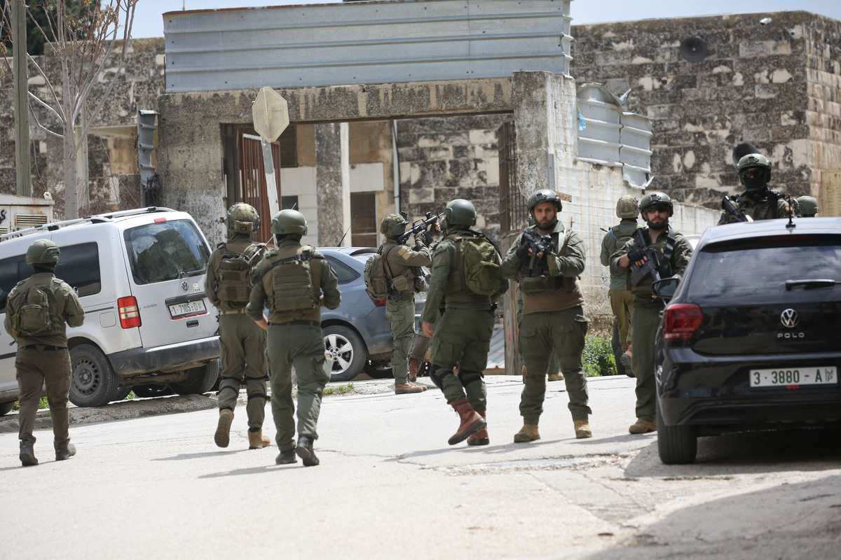 Israeli soldiers stand on a street during an Israeli army raid in the northern West Bank city of Nablus, in Nablus, West Bank, Palestine on April 12, 2026. [Nedal Eshtayah - Anadolu Agency]