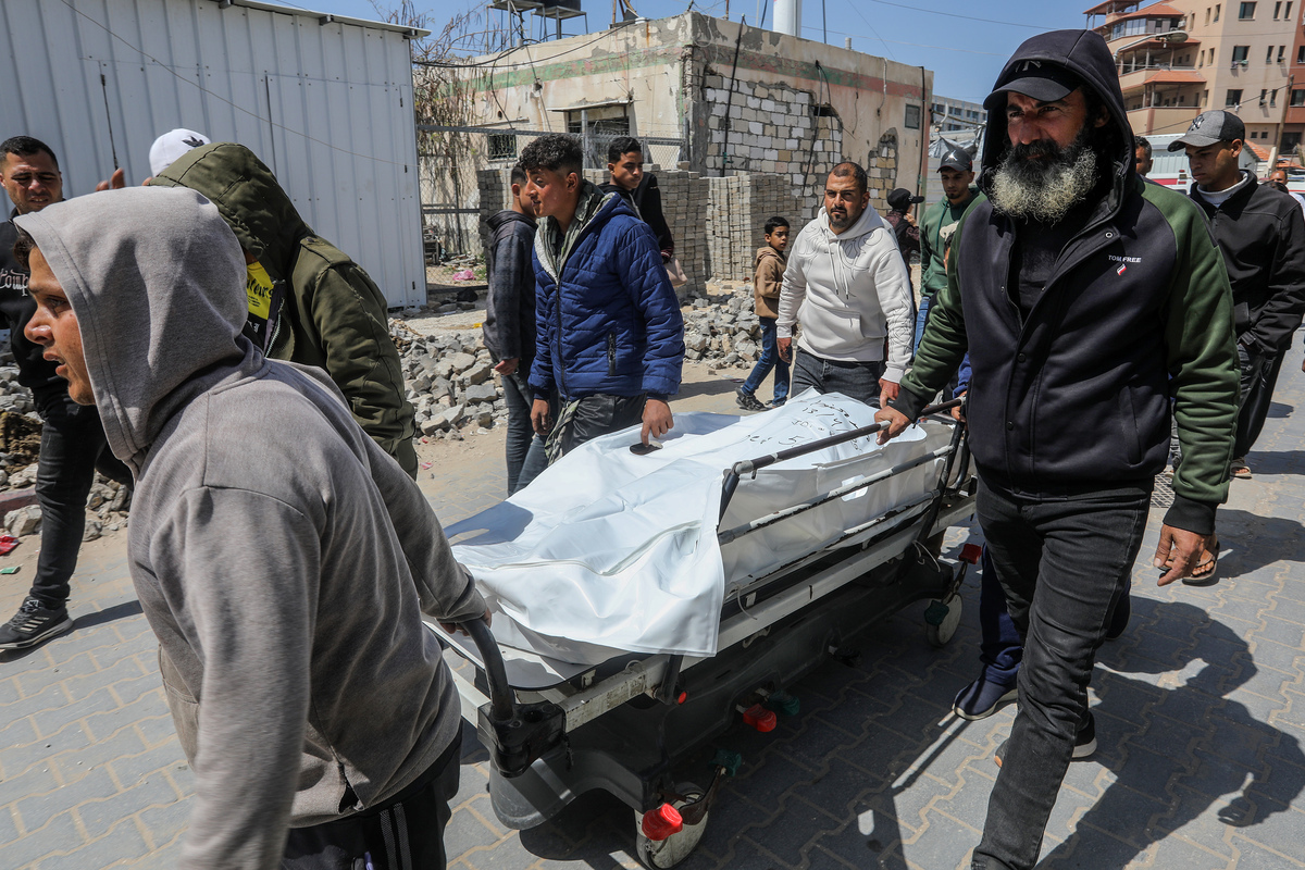 The bodies of Mahmoud al-Faqawi and Mohammed Shallouf, who were killed in an Israeli drone strike, are brought to Nasser Hospital in Khan Yunis, southern Gaza Strip, Palestine on April 13, 2026. [Abed Rahim Khatib - Anadolu Agency ]