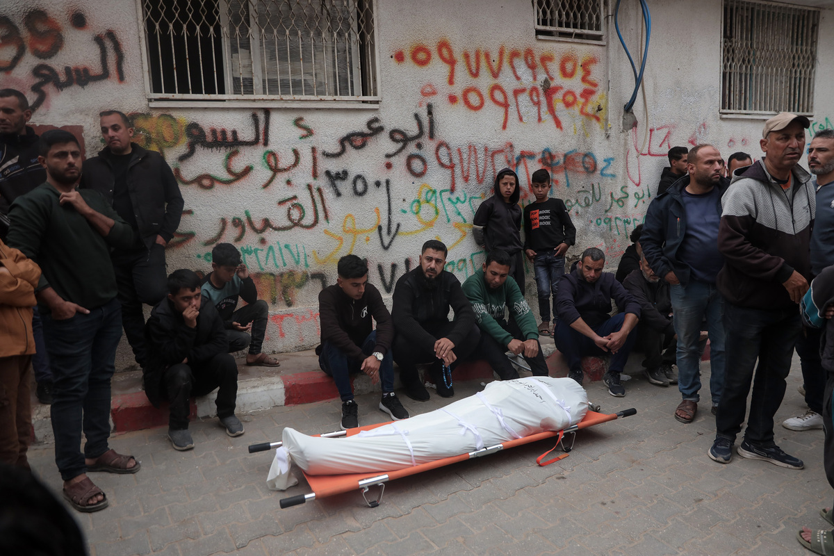 Palestinians who lost their relatives in an Israeli attack grieve during the funeral held outside their homes at Rimal neighborhood in Gaza City, Gaza, Palestine on April 15, 2026. [Abdalhkem Abu Riash - Anadolu Agency]