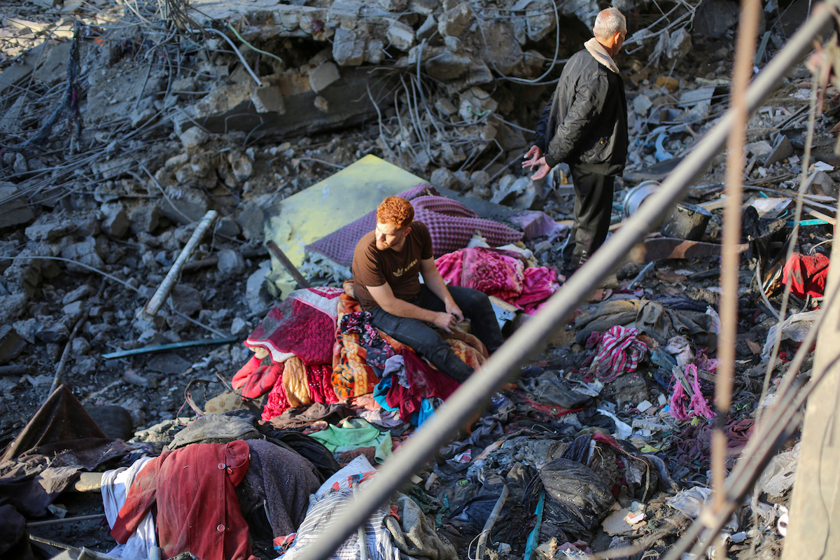 Palestinians inspect the destruction amid the rubble of buildings following Israeli military strikes targeting the Abu Saif family home despite the ongoing ceasefire in Nuseirat Refugee Camp, Gaza City, Gaza, Palestine on May 22, 2026. [Hassan Jedi - Anadolu Agency]
