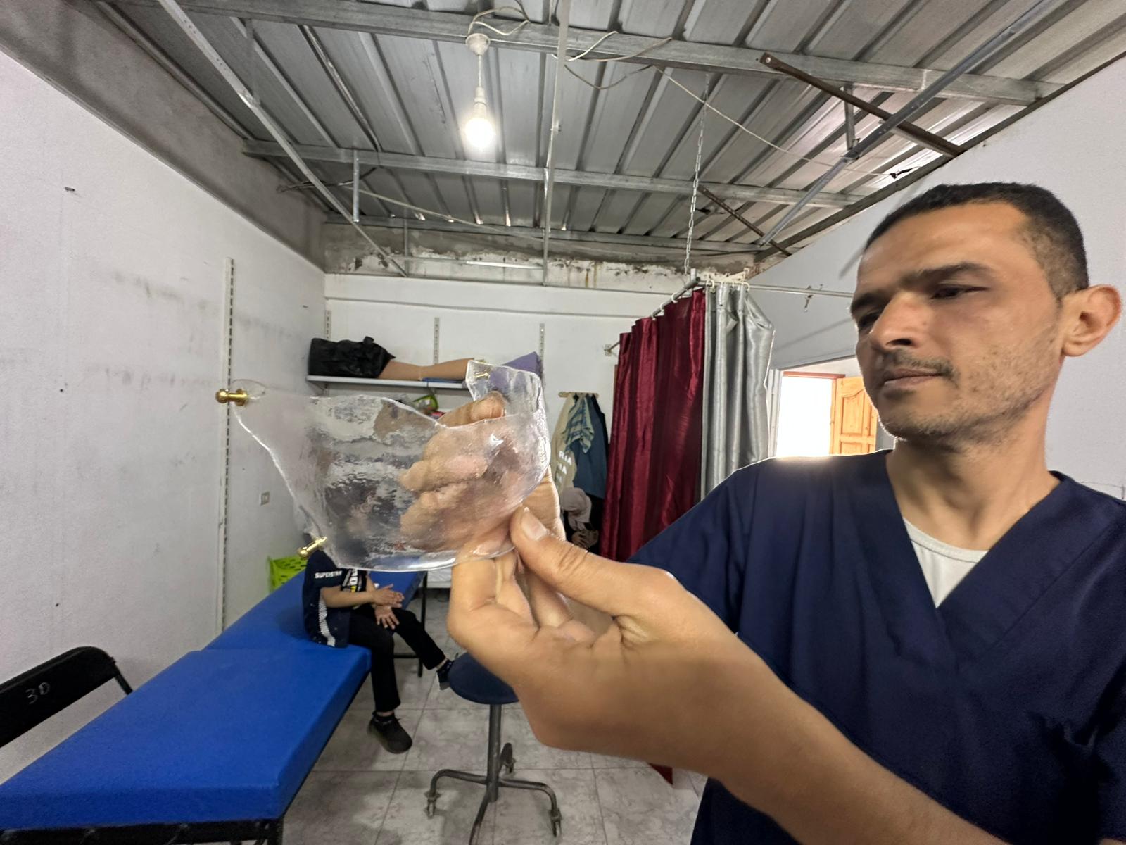The technical team at Médecins Sans Frontières is developing transparent plastic masks to reduce the visible impact of war injuries on Palestinians in Gaza, on 25 May 2026 [Mohammed Asad/Middle East Monitor]