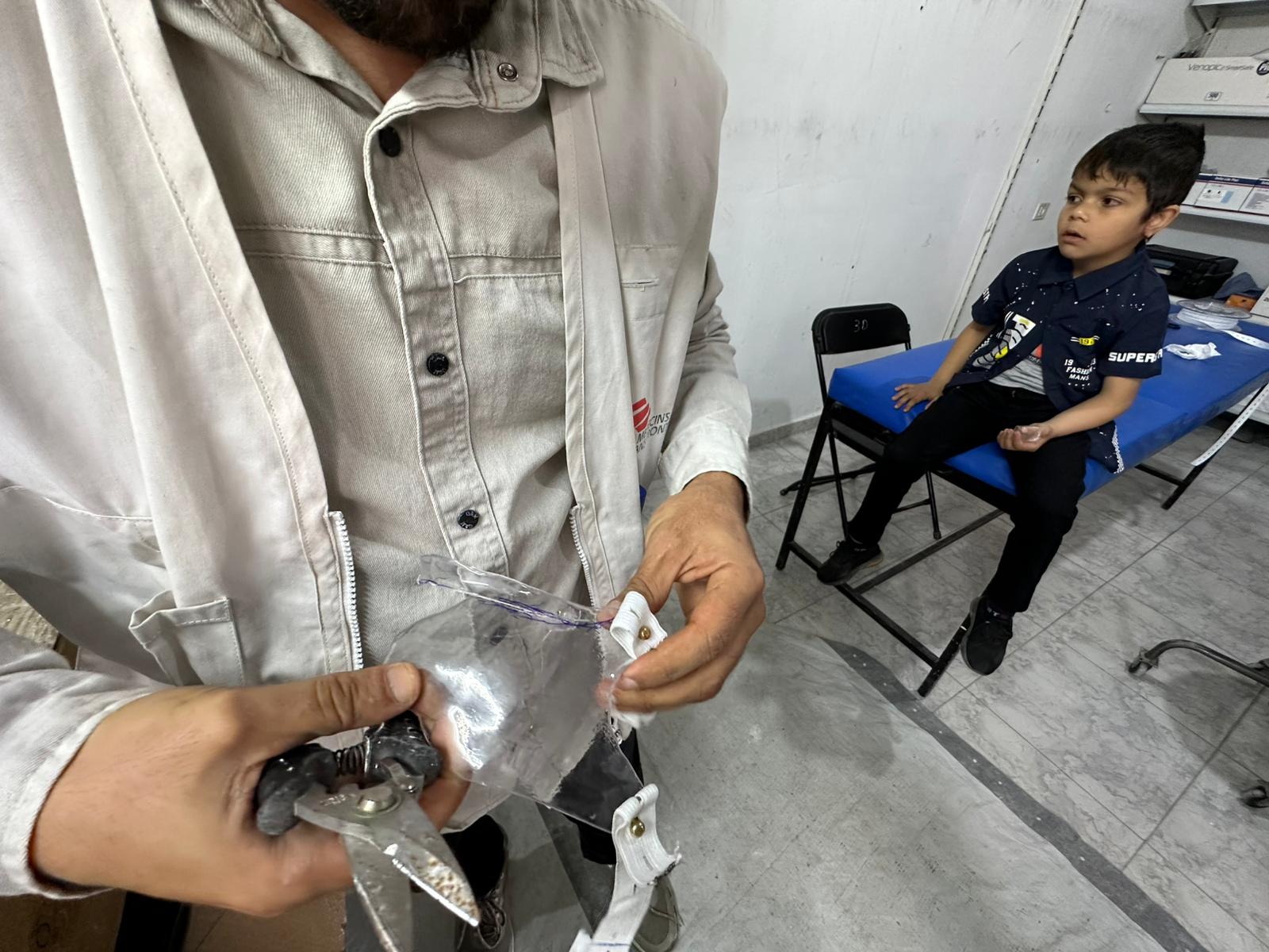 The technical team at Médecins Sans Frontières is developing transparent plastic masks to reduce the visible impact of war injuries on Palestinians in Gaza, on 25 May 2026 [Mohammed Asad/Middle East Monitor]