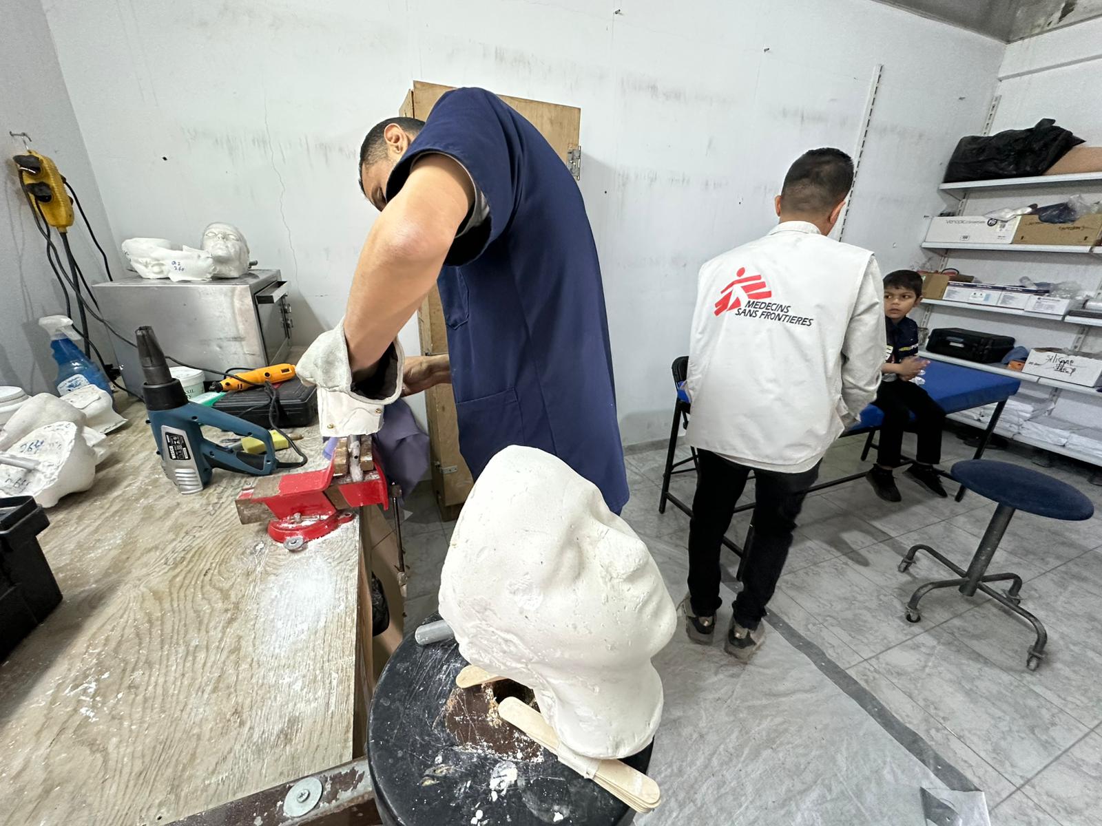 The technical team at Médecins Sans Frontières is developing transparent plastic masks to reduce the visible impact of war injuries on Palestinians in Gaza, on 25 May 2026 [Mohammed Asad/Middle East Monitor]