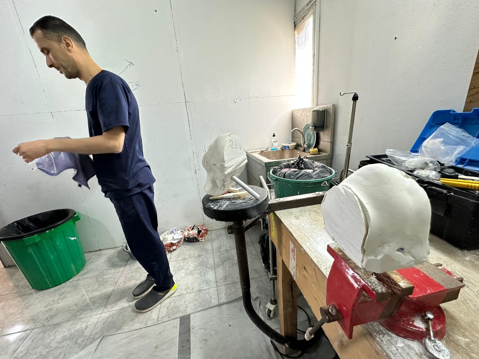 The technical team at Médecins Sans Frontières is developing transparent plastic masks to reduce the visible impact of war injuries on Palestinians in Gaza, on 25 May 2026 [Mohammed Asad/Middle East Monitor]