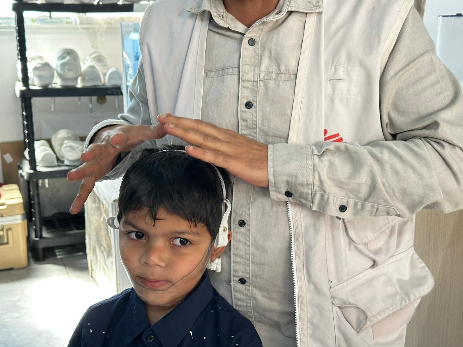 The technical team at Médecins Sans Frontières is developing transparent plastic masks to reduce the visible impact of war injuries on Palestinians in Gaza, on 25 May 2026 [Mohammed Asad/Middle East Monitor]
