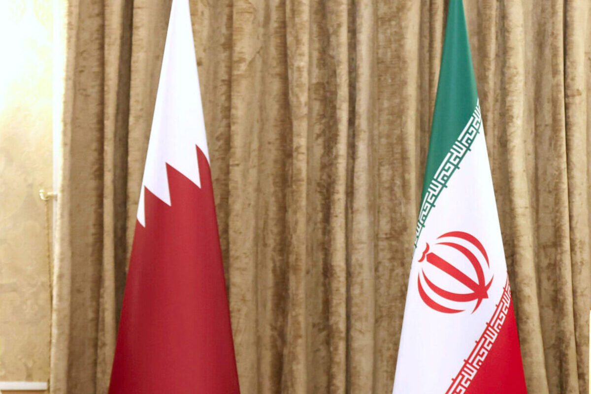 The flags of Qatar and Iran displayed together. [IRANIAN PRESIDENCY - Anadolu Agency]