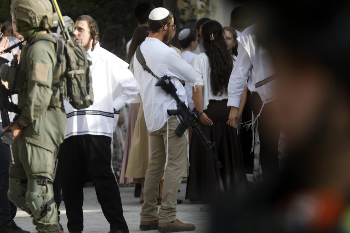 Israeli settlers raid the Old City of Hebron under the protection of Israeli security forces in the southern West Bank, Palestine on May 09, 2026. [Mamoun Wazwaz - Anadolu Agency]