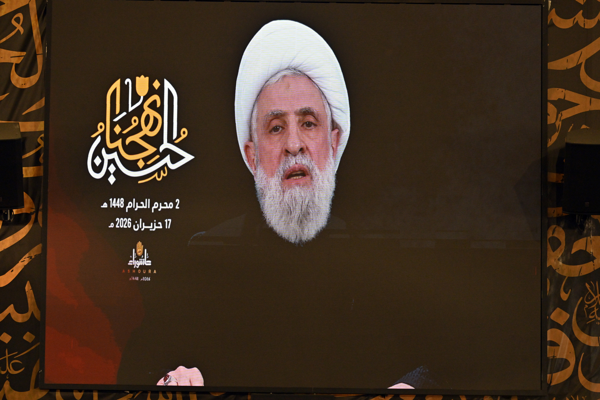 Hezbollah Secretary-General Naim Qassem addresses participants via video conference during an event marking the Day of Ashura at the tomb of former Hezbollah chief Hasan Nasrallah in the Dahieh district, south of the capital Beirut, Lebanon on June 17, 2026. [Houssam Shbaro - Anadolu Agency]