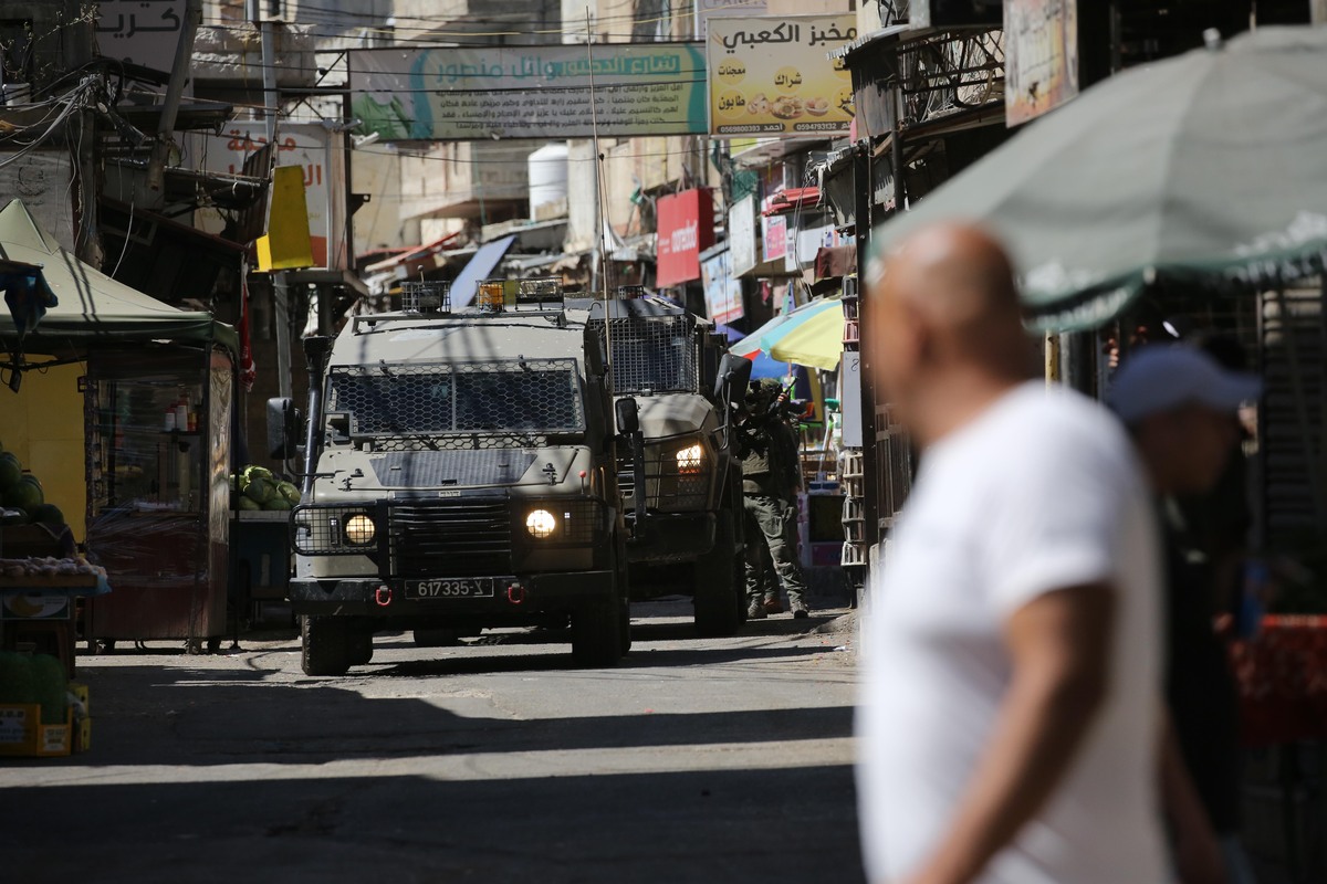 Israeli military vehicles and soldiers patrol the streets during a raid on Balata Refugee Camp in Nablus, West Bank, Palestine, on June 18, 2026. [Nedal Eshtayah - Anadolu Agency]
