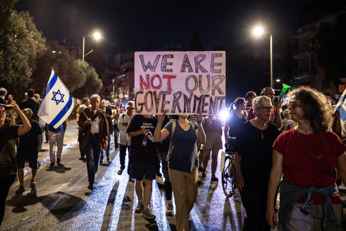 Demonstrators march and chant slogans during a protest against the Israeli government led by Prime Minister Benjamin Netanyahu in Jerusalem, on June 20, 2026. [Mostafa Alkharouf - Anadolu Agency]