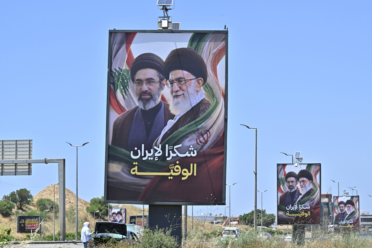 Billboards featuring the late former Iranian leader Ali Khamenei and his son Mojtaba Khamenei, who were killed in U.S. and Israeli attacks against Iran on February 28, are displayed on the Rafic Hariri International Airport highway with the text reading "Thank you, loyal Iran" in Beirut, Lebanon on June 21, 2026. [Houssam Shbaro - Anadolu Agency]