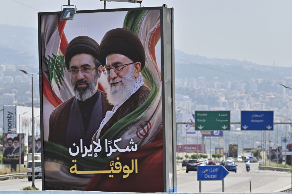 Billboards featuring the late former Iranian leader Ali Khamenei and his son Mojtaba Khamenei, who were killed in U.S. and Israeli attacks against Iran on February 28, are displayed on the Rafic Hariri International Airport highway with the text reading "Thank you, loyal Iran" in Beirut, Lebanon on June 21, 2026. [Houssam Shbaro - Anadolu Agency]