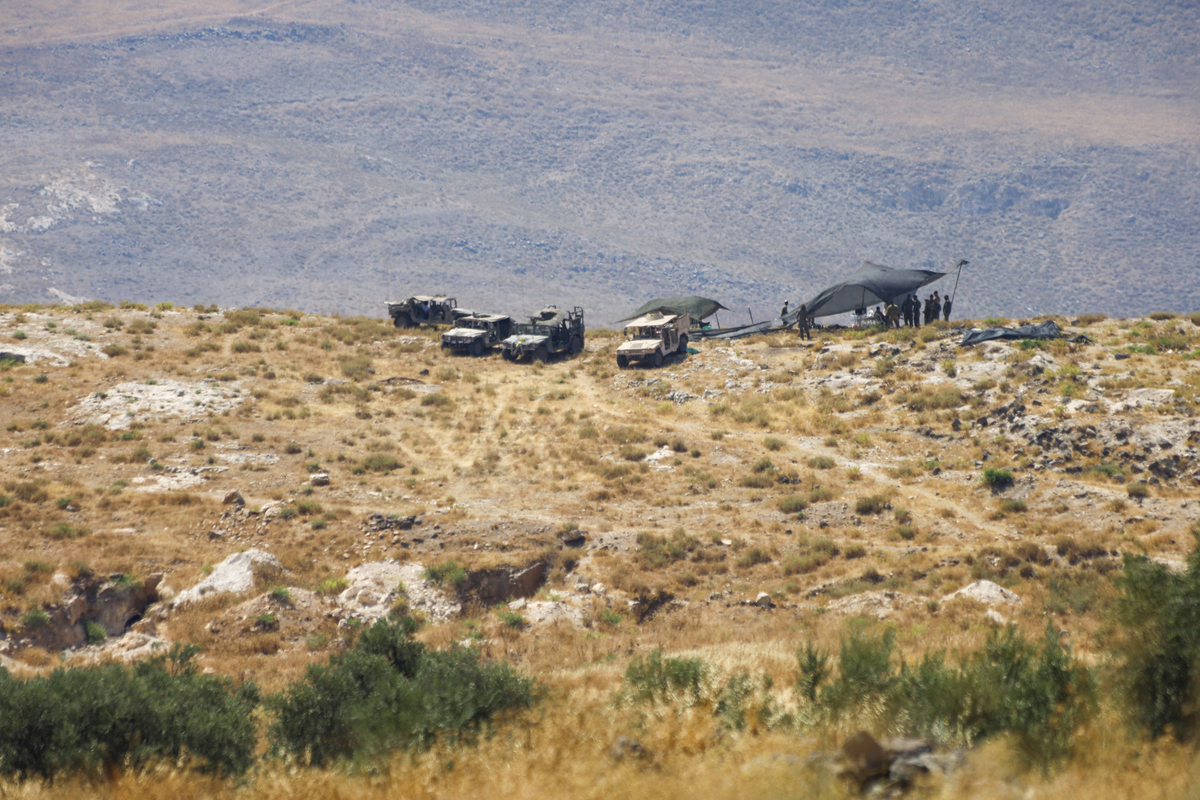 Elements of the Israeli military camp with armored vehicles along the strategic connecting road between the villages of Jamla and Saysoun in the western countryside of the Daraa Governorate in southern Syria on June 28, 2026. [Enver Asfur - Anadolu Agency]