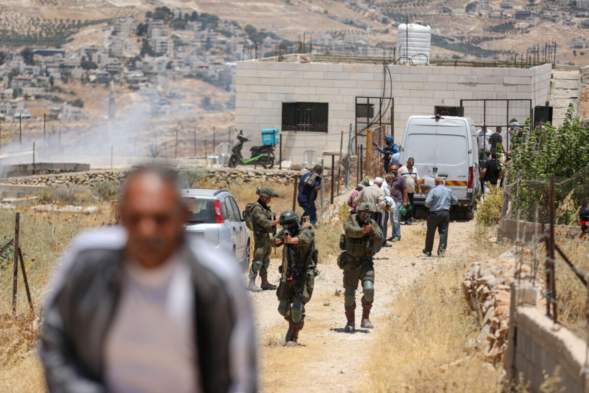 Israeli soldiers intervene with stun grenades and tear gas against Palestinians performing Friday prayers during a raid on the village of Abu Nujaym, near Bethlehem in West Bank, Palestine on July 03, 2026. [Wisam Hashlamoun - Anadolu Agency]