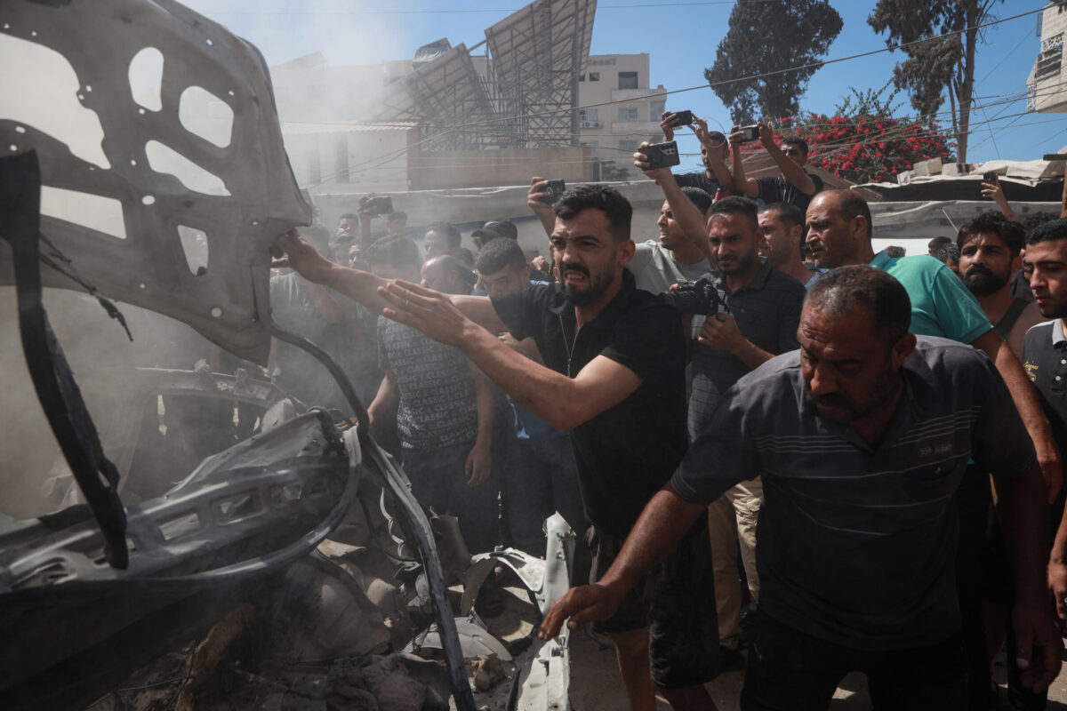 Palestinians gather at the scene after an Israeli drone strike targeted a civilian vehicle killing at least one Palestinian and injuring several others in western Gaza City, Gaza, Palestine, on July 9, 2026. [Abdalhkem Abu Riash - Anadolu Agency]
