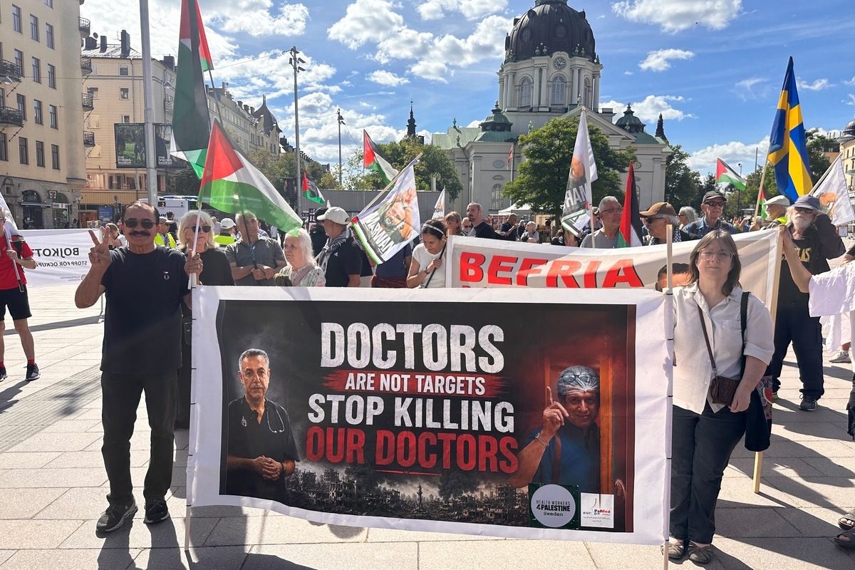 Hundreds of people, holding banners and flags, gather to protest Israel's attacks on Gaza, violations of ceasefires, and restrictions on the entry of humanitarian aid into the region in Stockholm, Sweden, on July 11, 2026 [Atila Altuntaş - Anadolu Agency]