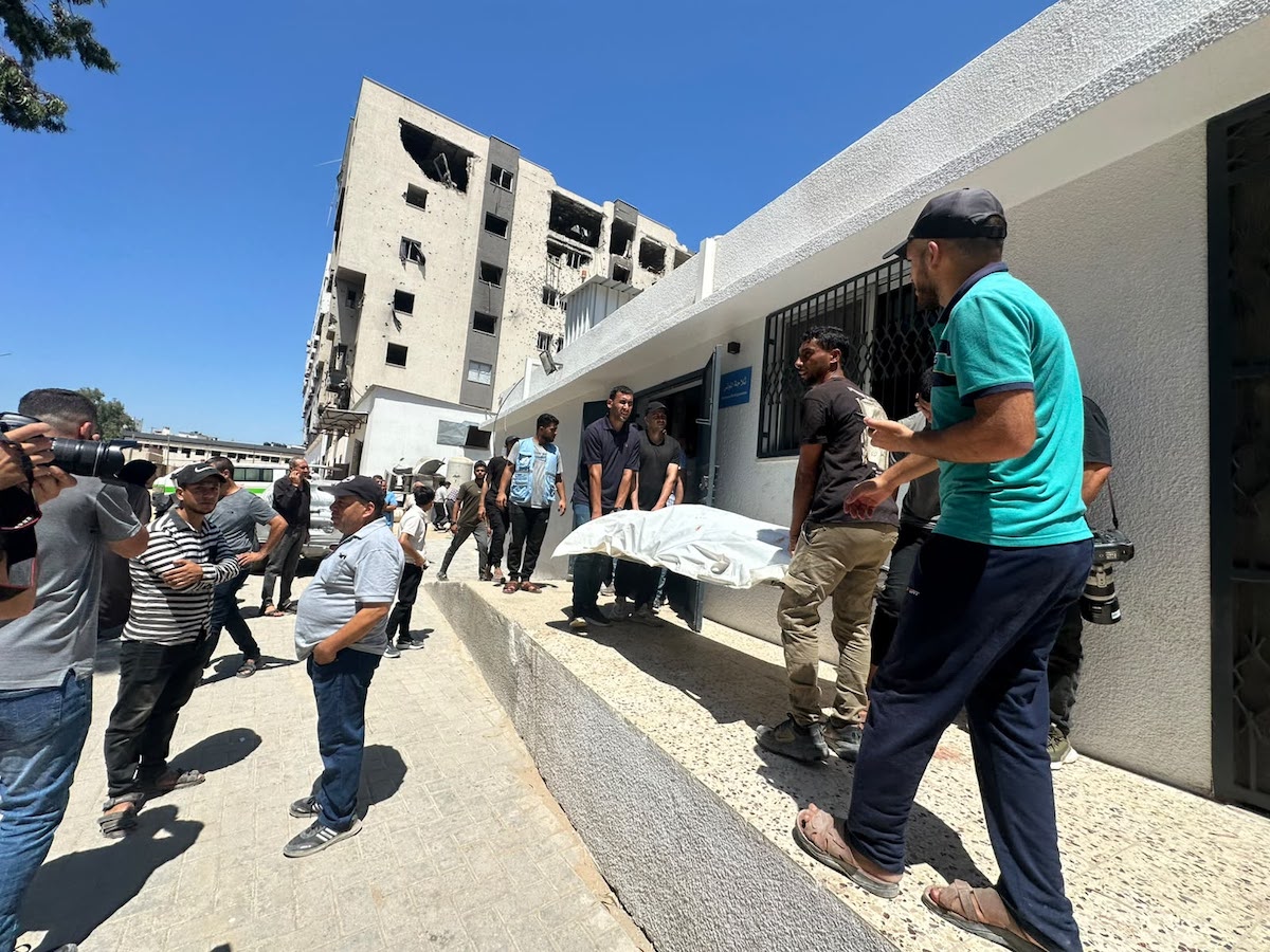 Palestinians mourn relatives killed in an Israeli strike on a police station west of the Jabalia Refugee Camp in the northern Gaza Strip in Gaza City on July 14, 2026. [Mohammed Asad/Middle East Monitor]