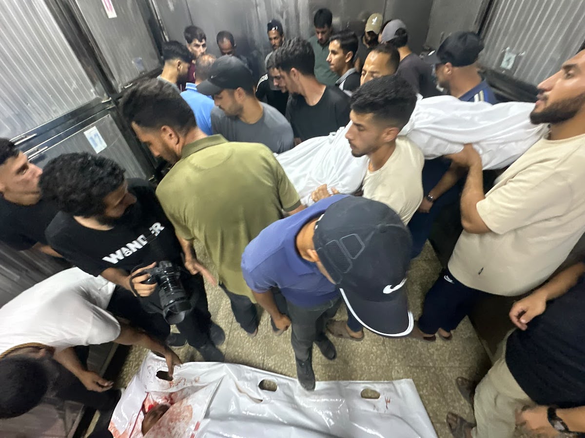 Palestinians mourn relatives killed in an Israeli strike on a police station west of the Jabalia Refugee Camp in the northern Gaza Strip in Gaza City on July 14, 2026. [Mohammed Asad/Middle East Monitor]