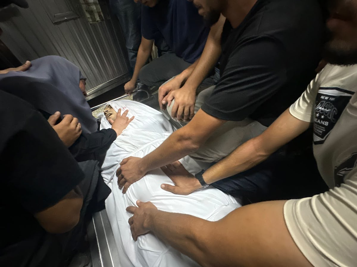 Palestinians mourn relatives killed in an Israeli strike on a police station west of the Jabalia Refugee Camp in the northern Gaza Strip in Gaza City on July 14, 2026. [Mohammed Asad/Middle East Monitor]