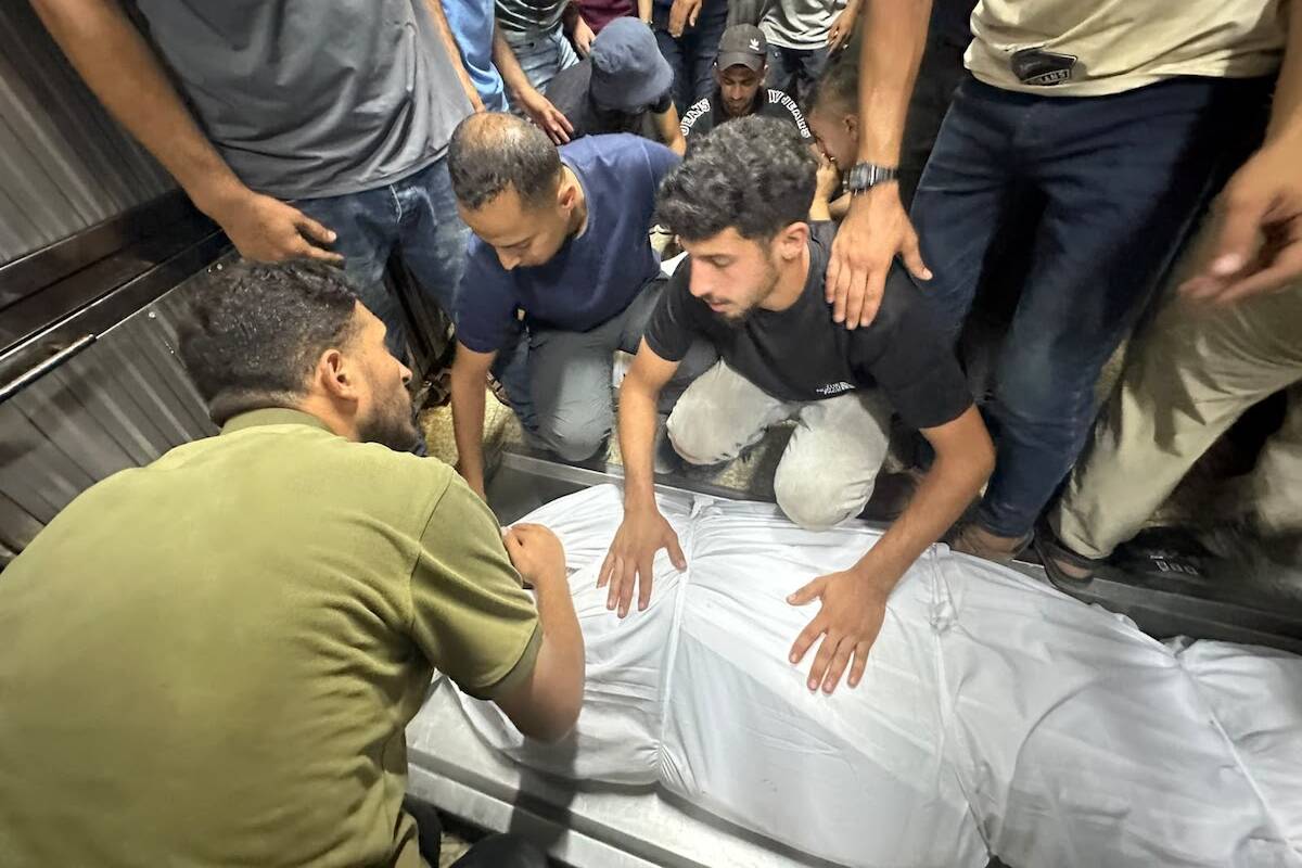Palestinians mourn relatives killed in an Israeli strike on a police station west of the Jabalia Refugee Camp in the northern Gaza Strip in Gaza City on July 14, 2026. [Mohammed Asad/Middle East Monitor]