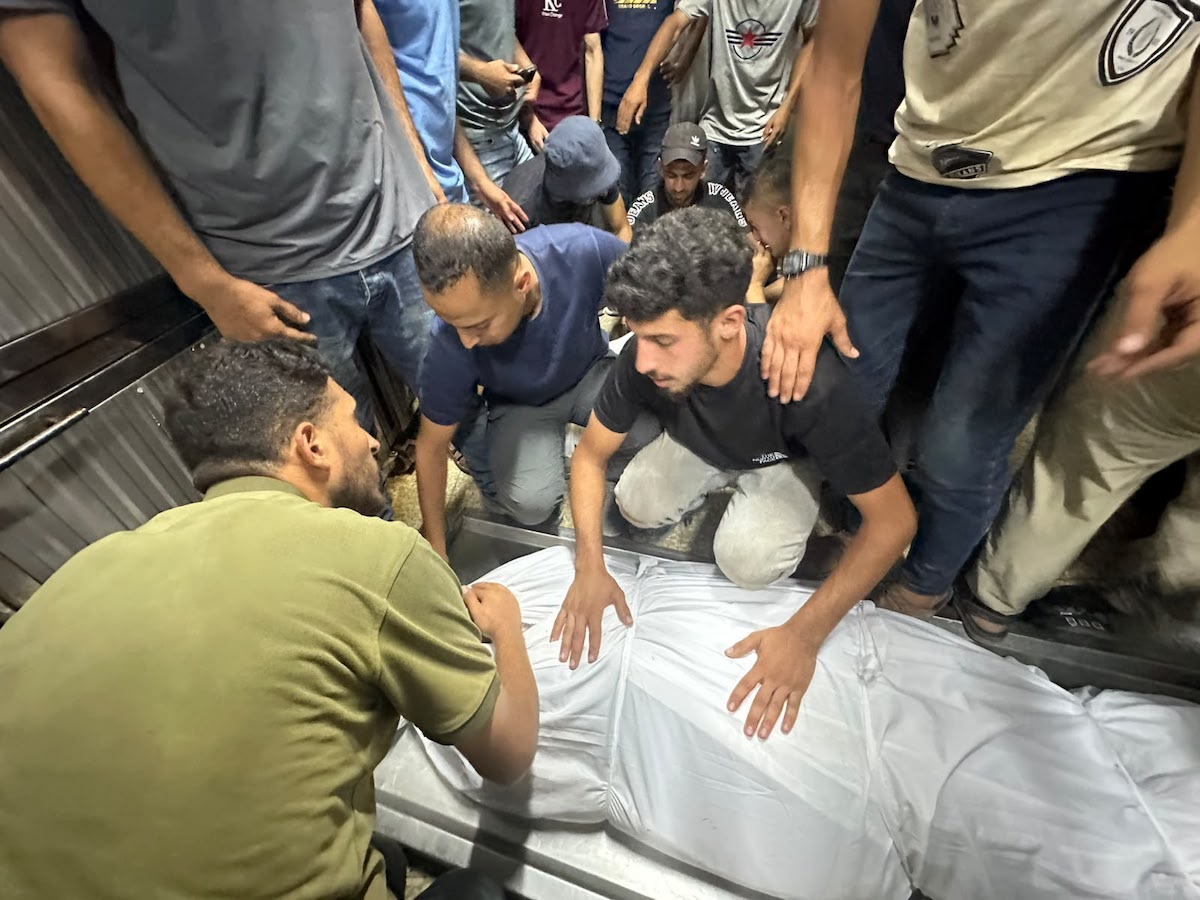 Palestinians mourn relatives killed in an Israeli strike on a police station west of the Jabalia Refugee Camp in the northern Gaza Strip in Gaza City on July 14, 2026. [Mohammed Asad/Middle East Monitor]
