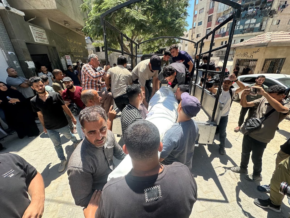 Palestinians mourn relatives killed in an Israeli strike on a police station west of the Jabalia Refugee Camp in the northern Gaza Strip in Gaza City on July 14, 2026. [Mohammed Asad/Middle East Monitor]