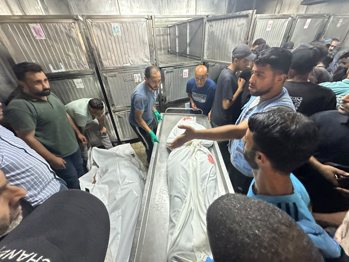 Palestinians mourn relatives killed in an Israeli strike on a police station west of the Jabalia Refugee Camp in the northern Gaza Strip in Gaza City on July 14, 2026. [Mohammed Asad/Middle East Monitor]
