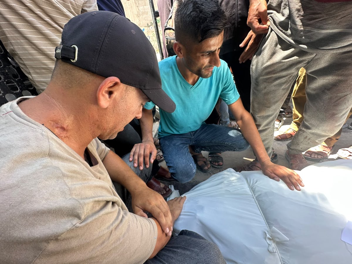 Palestinians mourn relatives killed in an Israeli strike on a police station west of the Jabalia Refugee Camp in the northern Gaza Strip in Gaza City on July 14, 2026. [Mohammed Asad/Middle East Monitor]